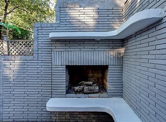 The outdoor fire place (fully functional) and sitting area.