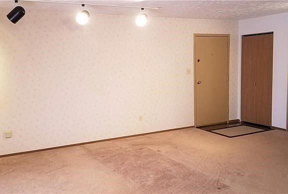 Spacious entry spills into open large, open living and dining area.