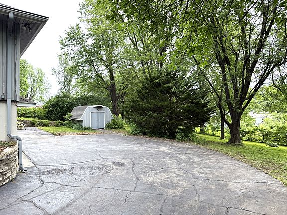 back drive to 2 car garage with extra shed