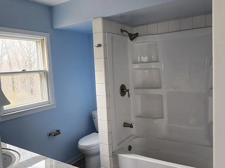 sorry for the stuff on the floor. Full completely renovated bathroom for just the main bedroom. wow