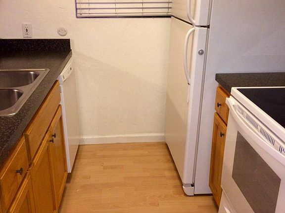 Kitchen includes d/w, electric stove top and oven, fridge