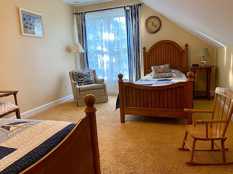 2nd floor 'kids' room with 2 twins and one trundle bed. This room looks out over the fenced in yard and includes books for all ages, toys and board games.