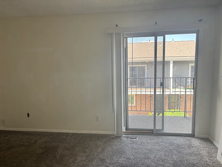 2nd Bedroom featuring en suite full bath, closet and balcony