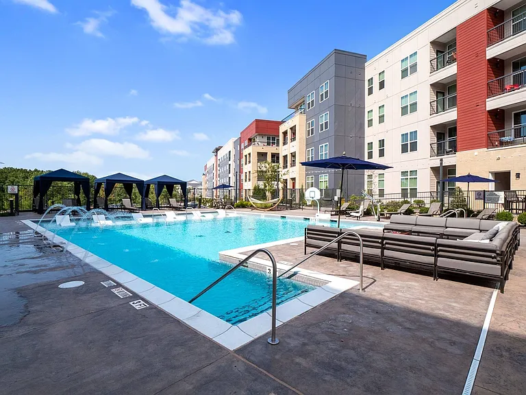 Resort-style pool with sundeck and cabanas