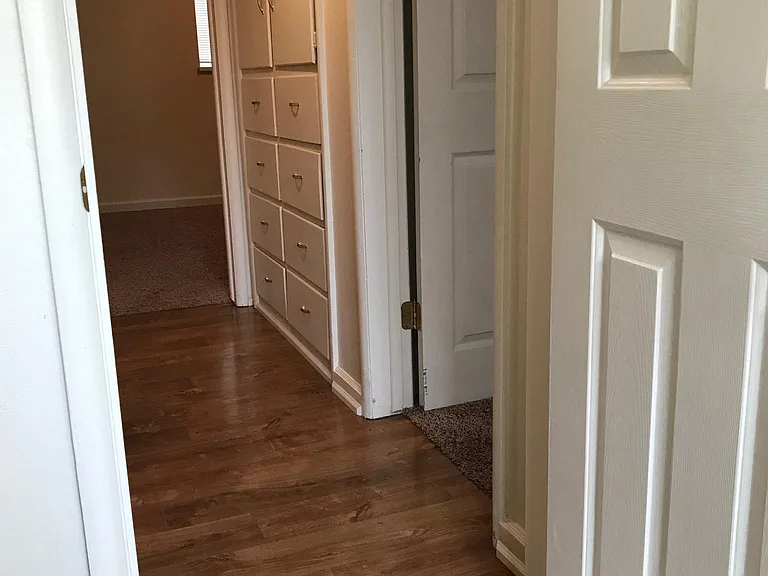 View from bathroom. Master bedroom in the distance. 2nd bedroom off to the right.