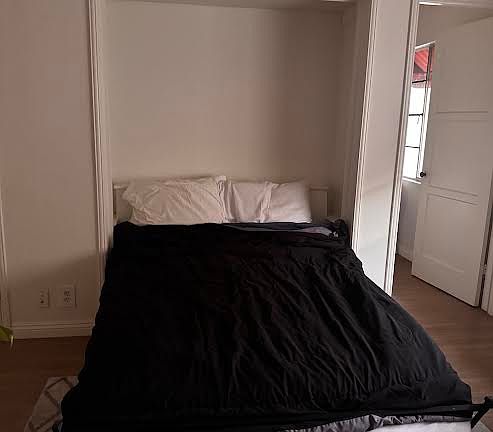 European-style foldaway wall bed; kitchen door; now you see it...