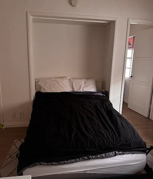 European-style foldaway wall bed; kitchen door; now you see it...