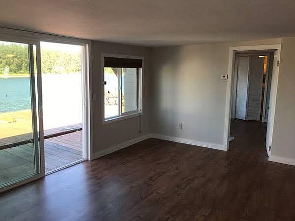 Living room with sliding door access to outside private deck