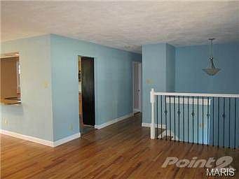 Open living space, open stairway to lower master suite...