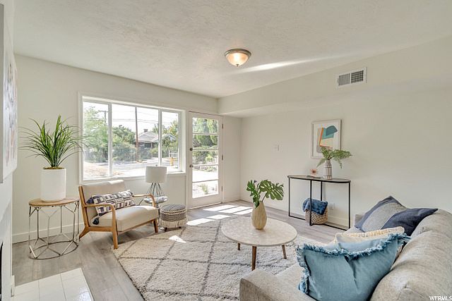 Living room with big window and tall ceilings