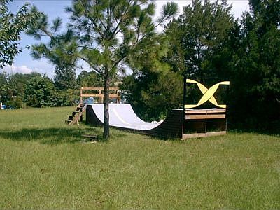 24 x 8 ft halfpipe in back of property