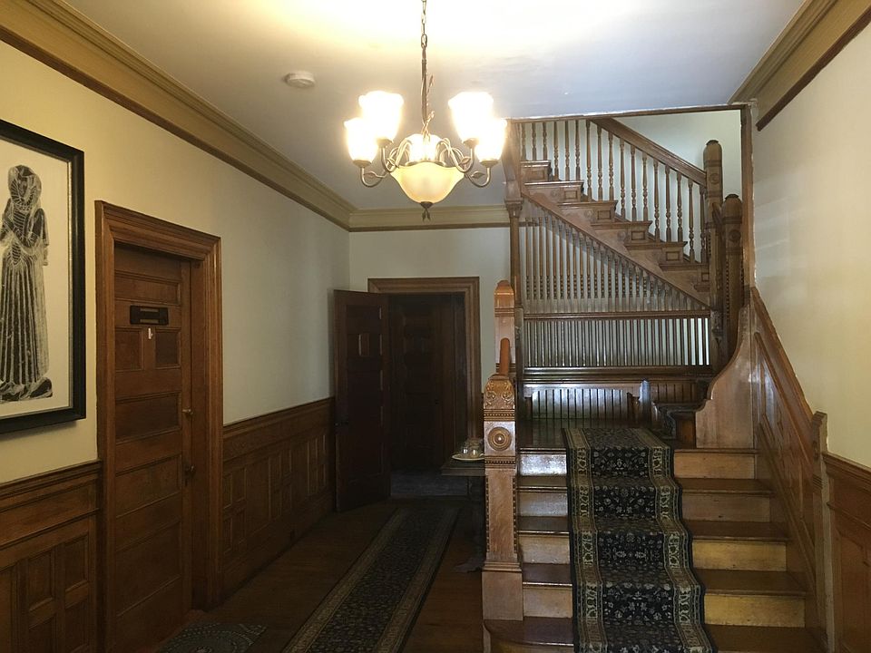 First floor foyer with beautiful woodwork.