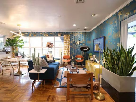 Open concept living/dining with large windows, original flooring, beautiful fixtures and fireplace. Furniture not included. Mounted TV is included in rent as desired.