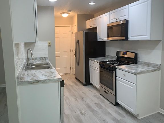 Kitchen with brand new white cabinets and appliances!