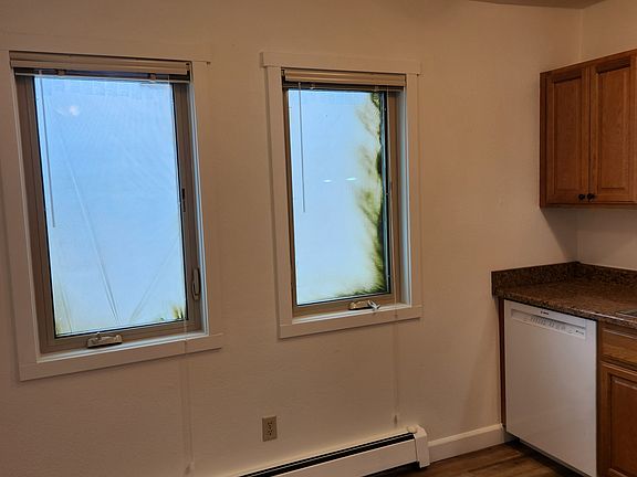 Eat in kitchen. Building being painted on the exterior.