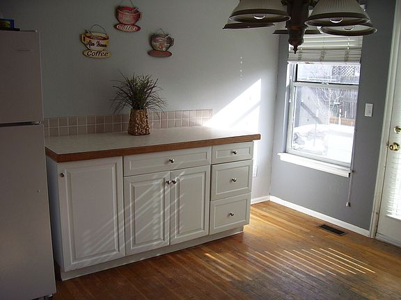 Other side of Kitchen with additional counter space and cabinets.
