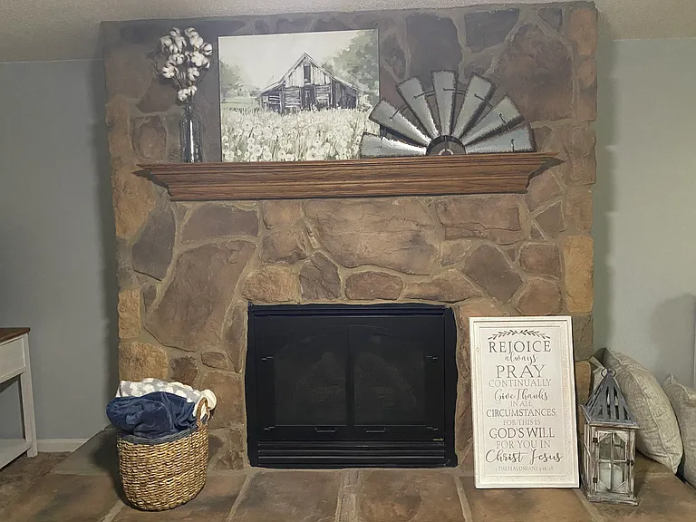Den with gas fireplace.