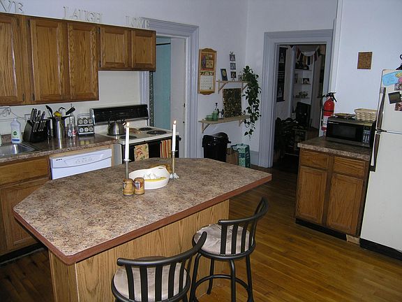 Kitchen Looking toward bath entrance on left and living room through door arch on the right.