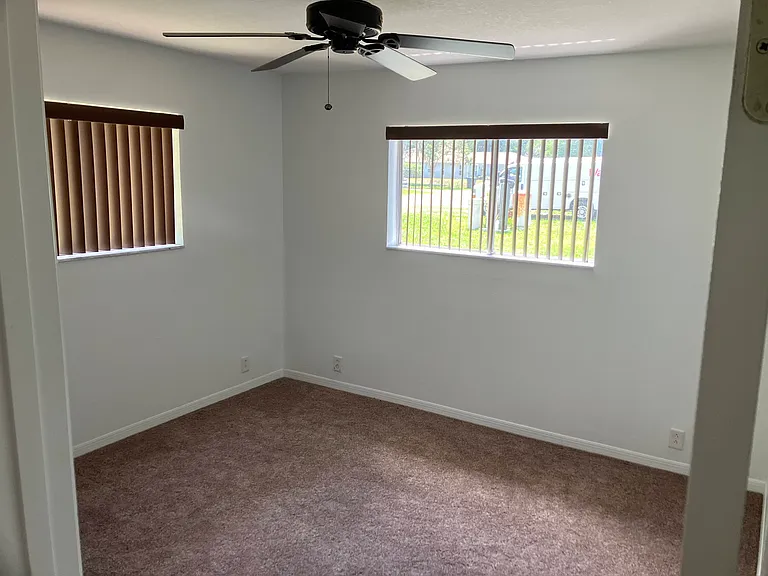 Second bedroom photo 1 of 2 can accommodate a queen size bedroom set with two nightstands and dresser