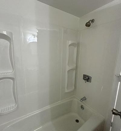 Brand new tub and surround in both bathrooms
