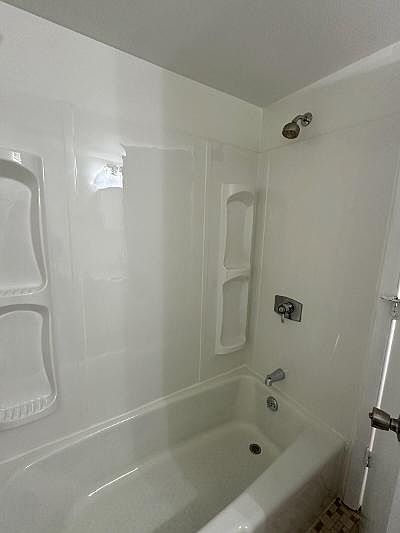 Brand new tub and surround in both bathrooms