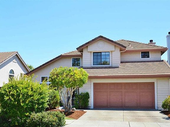 Open driveway leading to a large 2 car