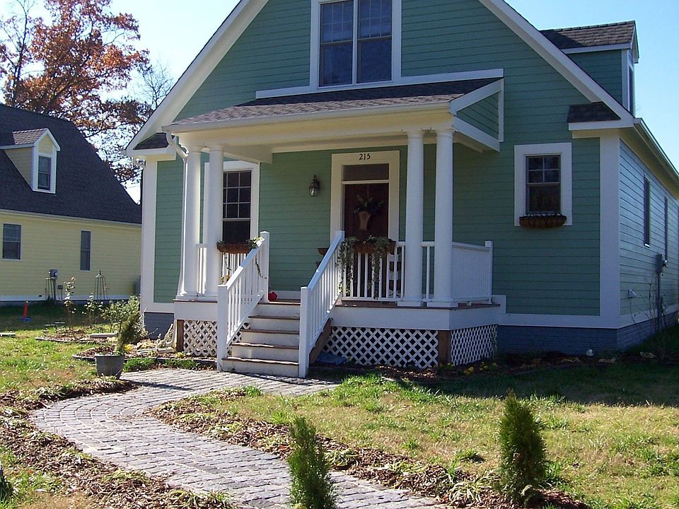 Cobblestone walkway & flower boxes complete the charm of this EcoFriendly Home
