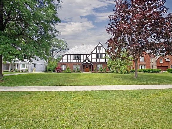 This 4 bedroom, 3 full/2 half bath Tudor is located on a street of fine homes.