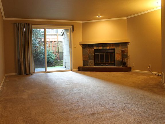 Living room facing back patio and fireplace
