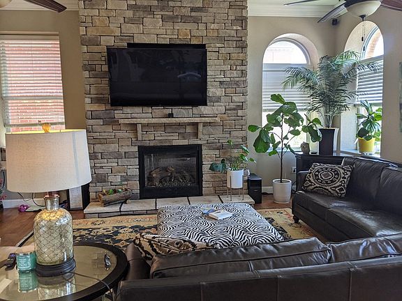Living room with Mendota fireplace. The television pictured has been replaced with a new 75" television.