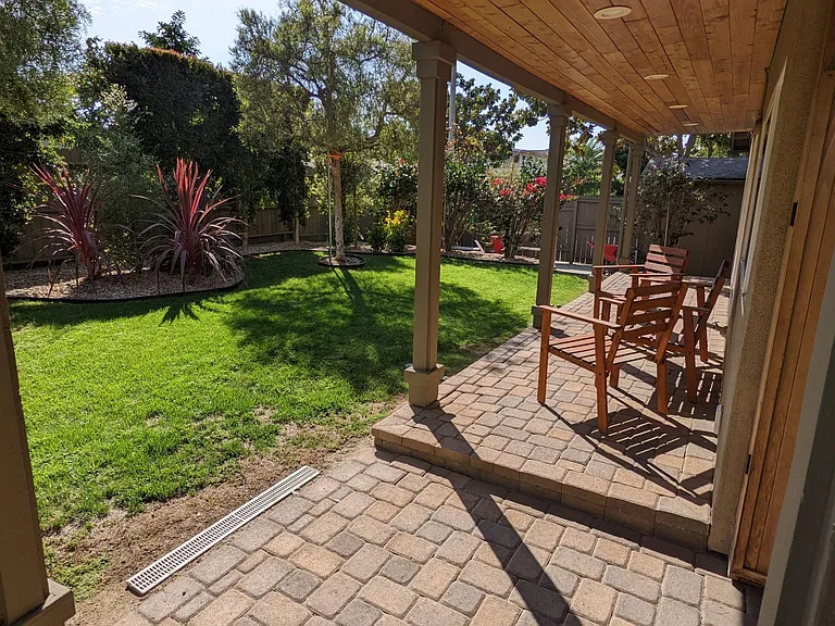 There is a wraparound patios with a redwood ceiling and recessed, dimmable lights