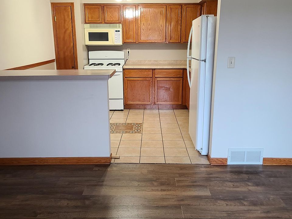 Kitchen cabinets redone, new fixtures, and breakfast bar that accommodates two stools each side....