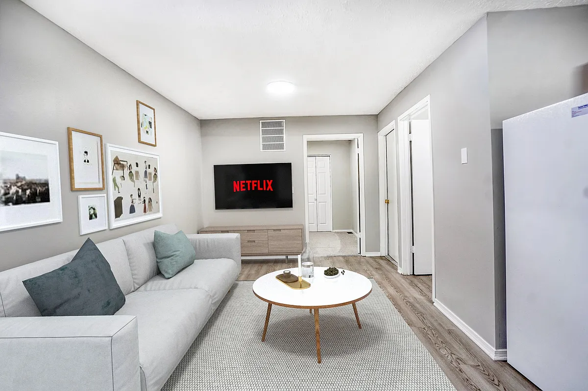 Elevate your living experience at Four Eight Group, where modern aesthetics meet comfort. This stylish living space features a cozy atmosphere, ideal for relaxation and entertainment. Schedule your tour today and find your perfect home! - Fowler Apartments