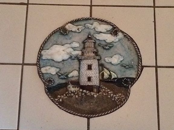 inlaid light house tile
