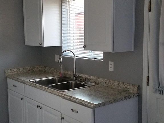Kitchen sink and side door to back yard