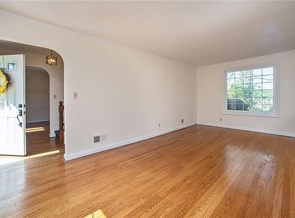 Living room with view of entry foyer