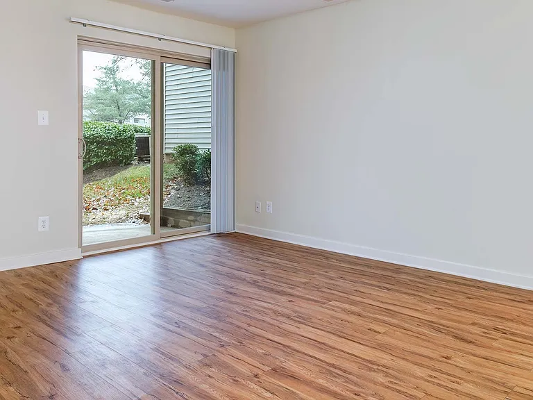 Spacious living room with private patio or balcony access