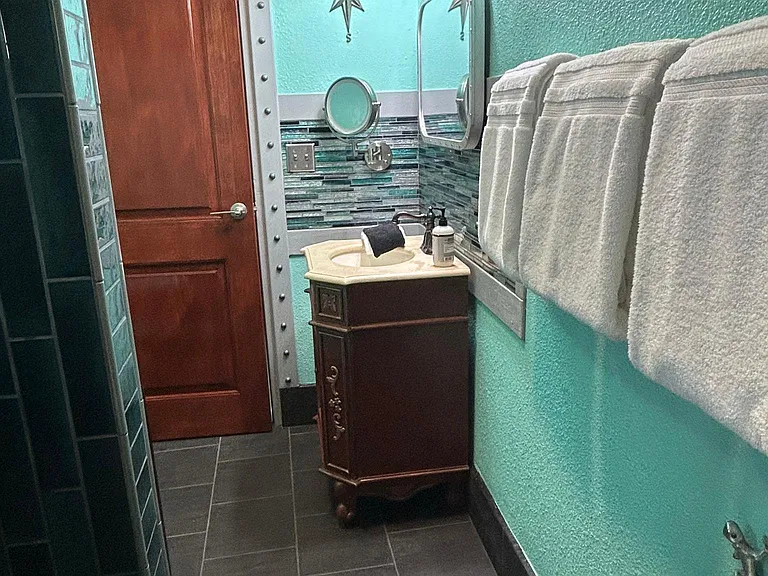 Rear view of full bathroom.