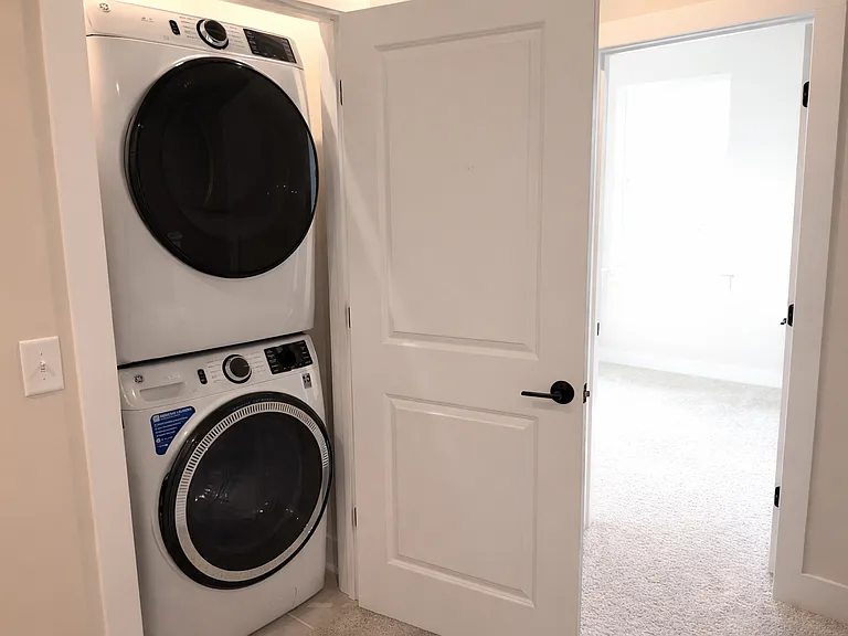 Laundry area with new washer and dryer
