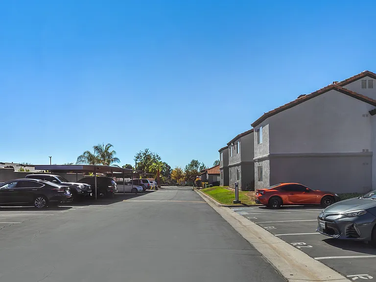 Sedona Apartments in Moreno Valley feature comfortable units, each with a dedicated parking spot and freshly paved parking for easy access.