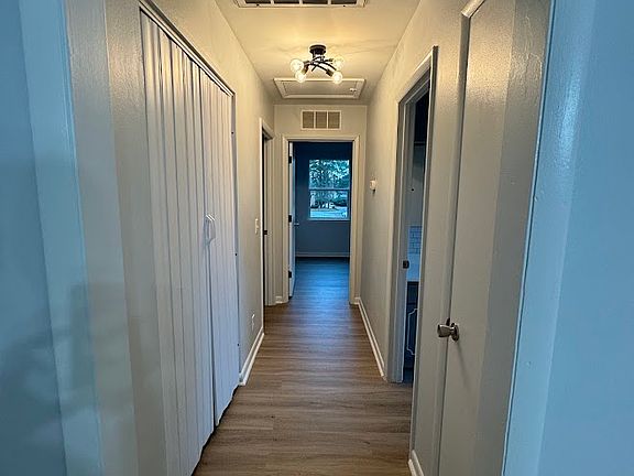 Full Laundry room and large linen closet.