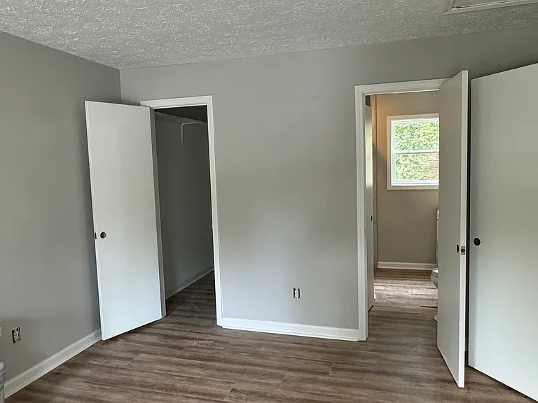 Master bedroom with walk-in closet and bathroom
