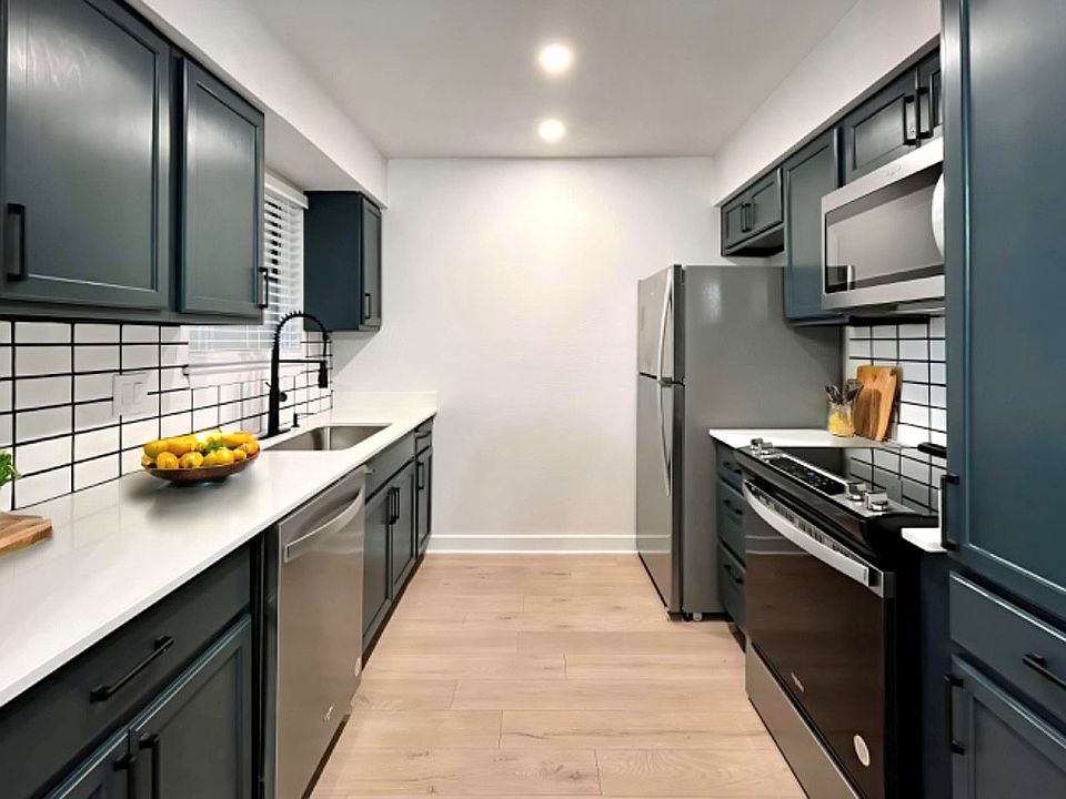 Quartz counters and subway tile backsplash in our renovated units!