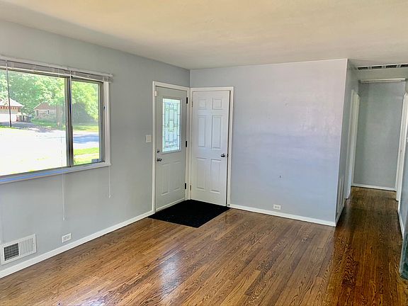 Living Room , Front Door and Hallway to 3 Bedrooms and the 1st floor Bath