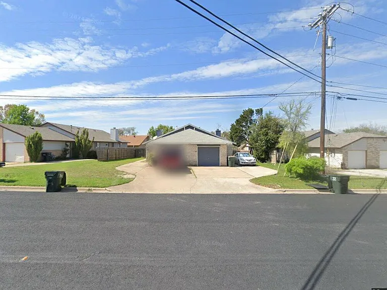 Single car garage with space in the driveway for 2-3 more cars.