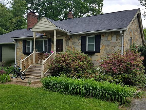 Don't let the quaint exterior fool you, there's a lot of space inside. Stone exterior with vinyl siding.