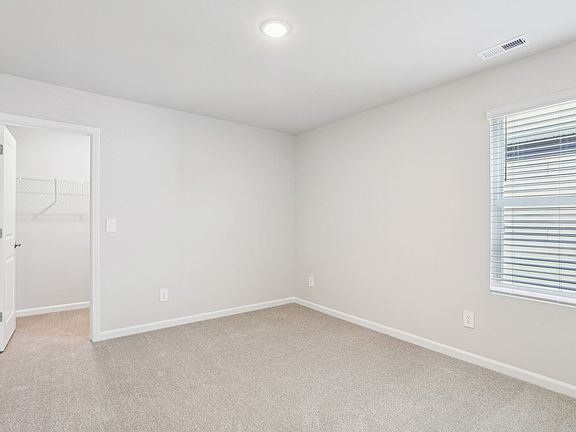 Secondary bedroom in the Johnson floorplan at a Meritage Homes community in Garner, NC.