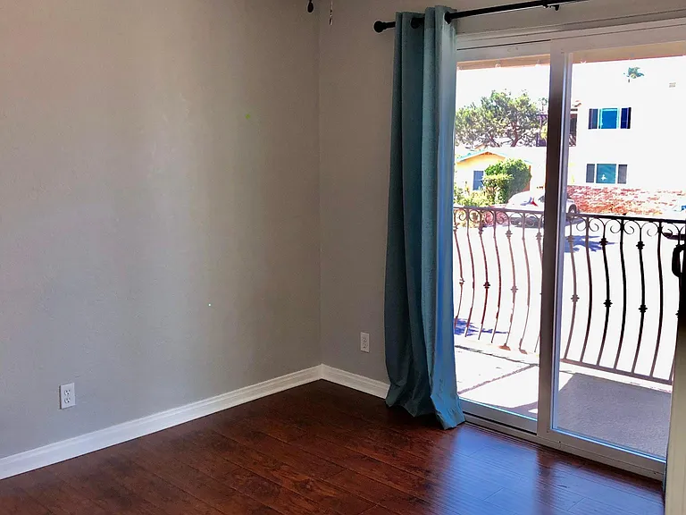 Second bedroom has a sliding door to the balcony