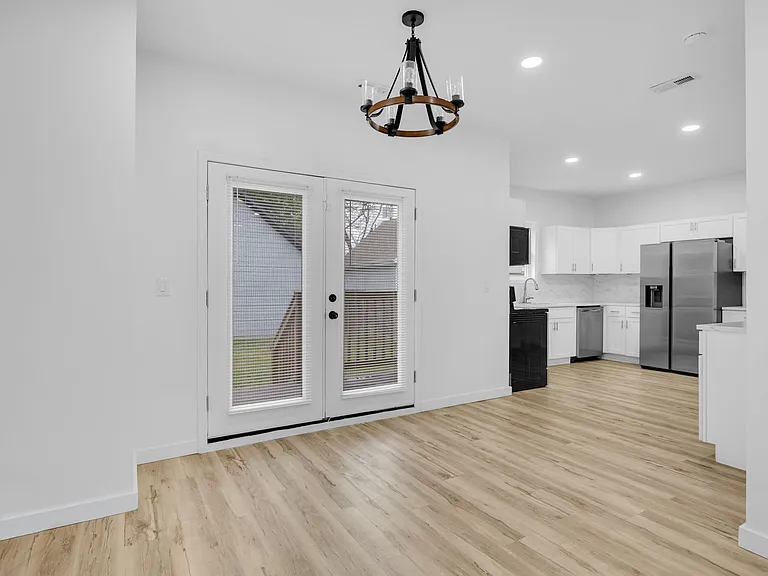 Dining area off of kitchen with access to back deck