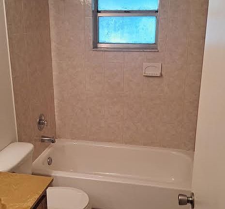 Bathrooms are tan in color, Picture shows them as pink